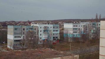 Large view of town with block of flats post communist. video