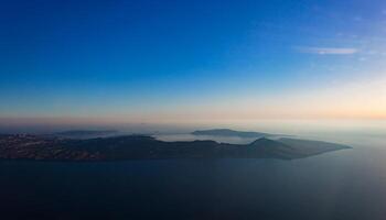 Aerial view of Santorini island as seen from plane window photo
