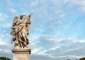 Angel statue on the bridge of Castle Sant'Angelo, Rome. photo
