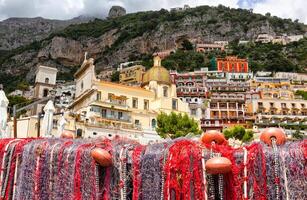 Fishing nets on the beach of Positano, view of Dome. photo