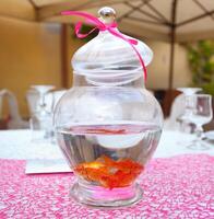 Goldfish in ampule used as centerpieces photo