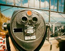 Coin operated binoculars with vintage effect on Empire State Building photo
