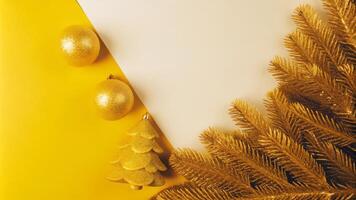 Christmas decor with golden fir leaves and ornaments photo