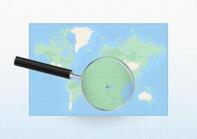 Map of the World with a magnifying glass aimed at Rwanda, searching Rwanda with loupe. vector