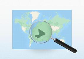 Map of the World with a magnifying glass aimed at Mali, searching Mali with loupe. vector