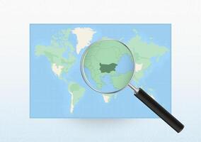 Map of the World with a magnifying glass aimed at Bulgaria, searching Bulgaria with loupe. vector