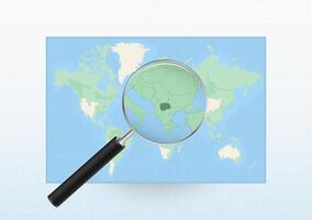 Map of the World with a magnifying glass aimed at Macedonia, searching Macedonia with loupe. vector