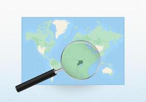 Map of the World with a magnifying glass aimed at Uganda, searching Uganda with loupe. vector