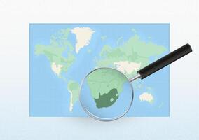 Map of the World with a magnifying glass aimed at South Africa, searching South Africa with loupe. vector