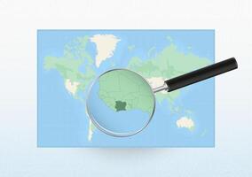 Map of the World with a magnifying glass aimed at Ivory Coast, searching Ivory Coast with loupe. vector