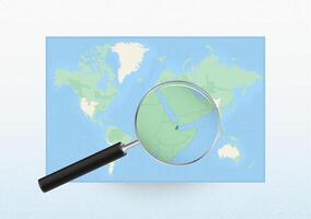 Map of the World with a magnifying glass aimed at Djibouti, searching Djibouti with loupe. vector