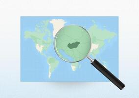 Map of the World with a magnifying glass aimed at Hungary, searching Hungary with loupe. vector