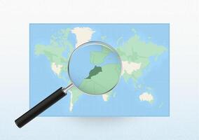 Map of the World with a magnifying glass aimed at Morocco, searching Morocco with loupe. vector