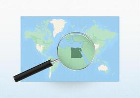 Map of the World with a magnifying glass aimed at Egypt, searching Egypt with loupe. vector
