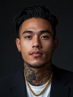 Portrait of a man with tattoos and styled hair in a formal outfit photo
