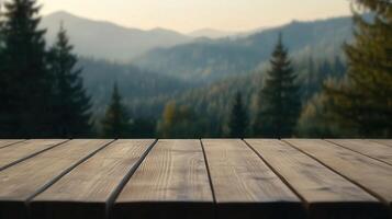 Wooden table overlooking a mountain landscape during sunset hours photo