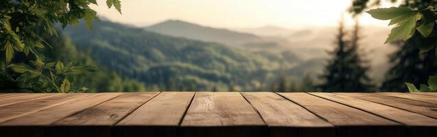 A wooden tabletop overlooks a serene mountain landscape at sunset photo