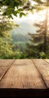 Wooden table foreground with blurred forest view in the background photo