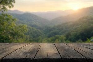 Sunset view from a wooden table overlooking lush green mountains photo