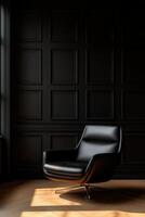 Elegantly designed black swivel chair in a shadowed room corner photo