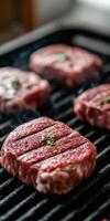 Fresh beef steaks grilling on a barbecue during a summer cookout photo