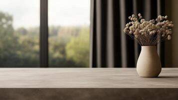 Simple vase with dried flowers on a table near a large window photo