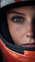 Close-up of a female racer in a vibrant helmet before the race photo