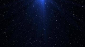 White particles flying in a circle in rays of blue light. Snow. Seamless looping animation. video