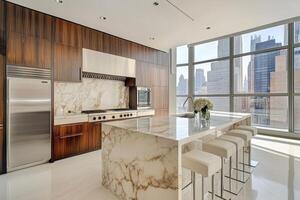 Modern kitchen with a marble countertop and white stools photo