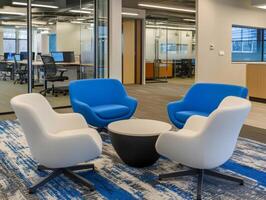 Group of chairs and a table are arranged in a room with a blue carpet photo