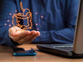 Man shows the large intestine graphic mockup of a person sitting in the office photo