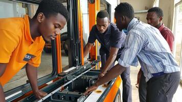 A group of men working on a vehicle video