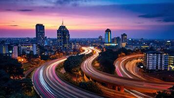 A city skyline at dusk with traffic on the highway video