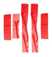 Top view set of wrinkled red adhesive vinyl tape or cloth tape in stripes shape isolated on white background with clipping path photo