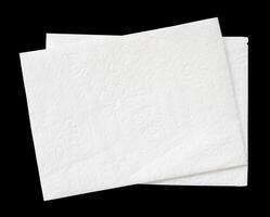 Top view of two folded white tissue paper in stack isolated on black background with clipping path photo