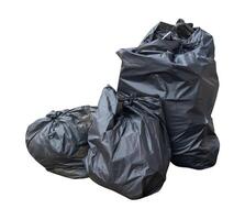 Front view of garbage in black plastic bag at garbage dump isolated on white background with clipping path photo