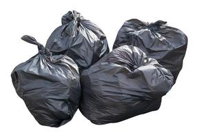 Front view of garbage in black plastic bag at garbage dump isolated on white background with clipping path photo
