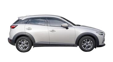 Side view of silver hatchback car isolated on white background with clipping path photo