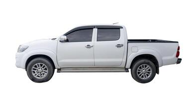 Side view of white pickup truck isolated on white background with clipping path photo
