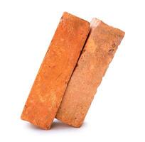 Side view of old red or orange bricks in stack isolated on white background with clipping path photo