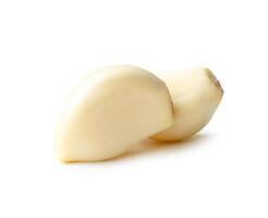 Side view of peeled garlic cloves in stack isolated on white background with clipping path photo