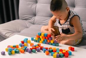 Children enjoy colourful game with educational toy blocks that make play fun activity, enhancing their development during childhood. gathering, creation, exercise, inspiration, improvement, practice. photo
