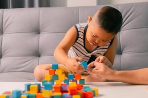 Children enjoy colourful game with educational toy blocks that make play fun activity, enhancing their development during childhood. gathering, creation, exercise, inspiration, improvement, practice. photo