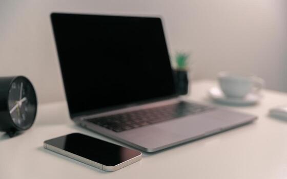 Remote work relies on technology, with employees using laptops and computers from home to communicate and conduct business online via network. comfortable, display, efficient, electronic, minimalist. photo