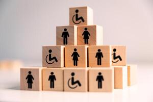 Concept of inclusion and equity in employment ensures that people with disabilities are provided equal opportunities in diverse work environment, promoting both business success and health equality. photo