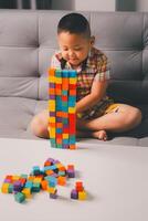 Children enjoy colourful game with educational toy blocks that make play fun activity, enhancing their development during childhood. gathering, creation, exercise, inspiration, improvement, practice. photo