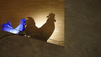 The chicken sculpure on the roof with the lights on at night photo