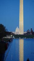 The monument tower view with the sunset sky as background in Washington DC photo