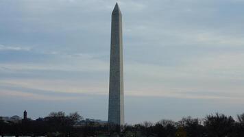The monument tower view with the sunset sky as background in Washington DC photo
