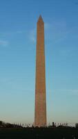 The monument tower view with the sunset sky as background in Washington DC photo